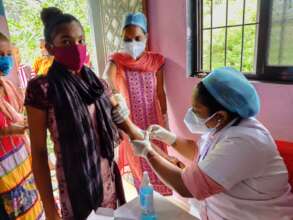 Nurse taking a blood sample for Haemoglobin test