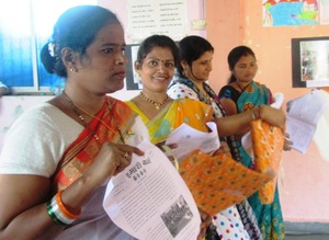 Mothers with Newsletter prepared by their daughers