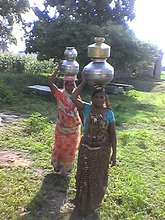 The traditional way of head-carrying water