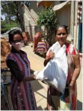 Distributing to a  grateful mother