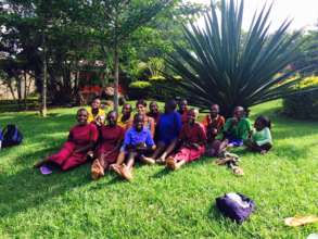 Sponsored school girls sit with SHF founder Robin