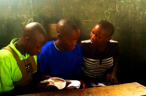 Three school girls looking at their new pads