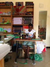 Woman sewing at the new Tailoring Center