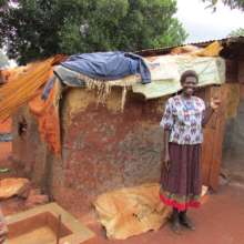 One of our women beaders, Margaret, at her home.