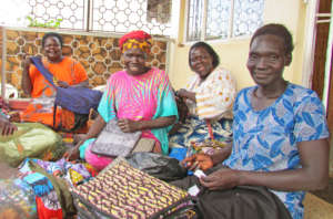 Jinja women inspecting items they made july 2017