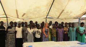 Volunteer Christa with her English class students
