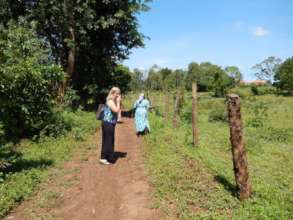 Board member Wendy looking at fenced property.