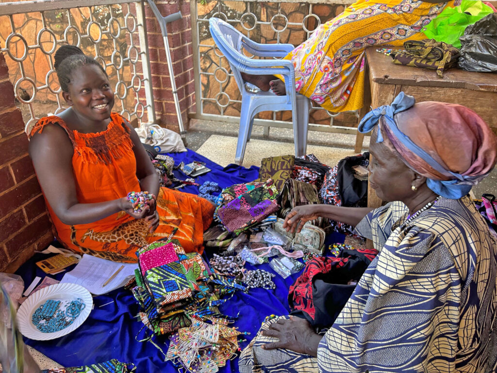 Jinja women collecting fair trade crafts for U.S.