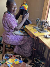 Molly busily sewing new fabric creations Nov. 2023