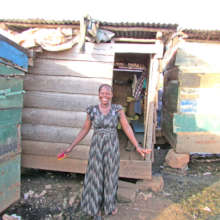 Santa Outside Her Shop in Jinja Uganda