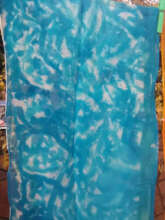 One of the tie dyed silk scarves in turquoise