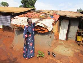 Akello Rose Shows her Roof of Plastic Sheeting