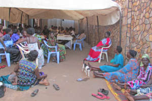 Women's group meeting to discuss project details