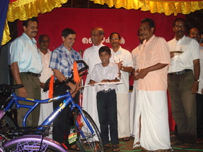 Eddy presiding at a bike distribution at St Joseph High School