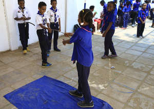 Children play acting the water safety messages