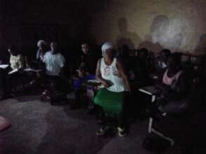 Adult Literacy Students Attempting Class in Dark