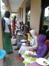 New girls having lunch after journey