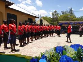 Safe House Girls singing at the opening