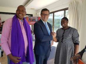 Rhobi receiving award from EU Ambassador