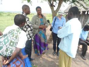 LInda Pressly (BBC) recording village meeting