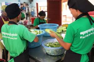 Cooking students help to prepare the meals