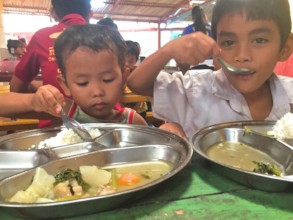 After cleanup, children again enjoying hot lunches