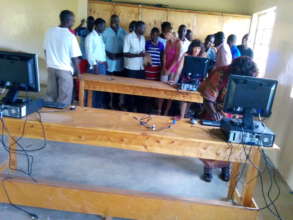 our donor and friend showing students  how to use