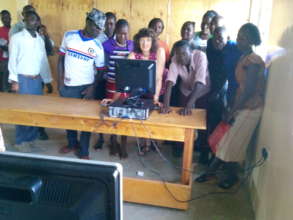 students having fun first time touching a desk top