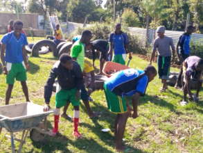 our youth helping at the children home