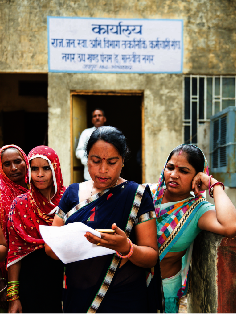FLP Leader with the women in a commuity