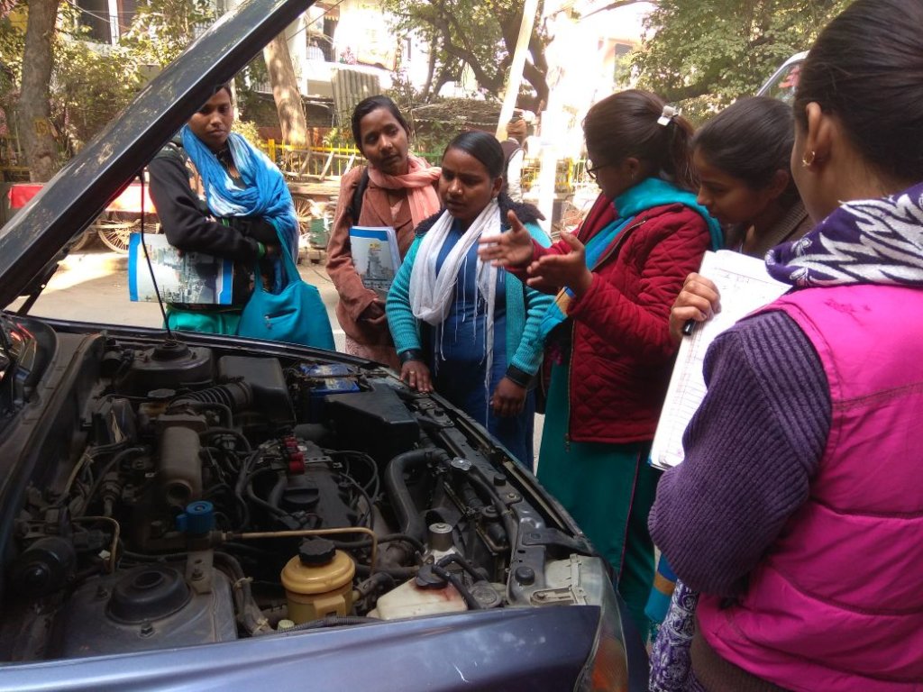 Trainer Geeta leading a car maintainance session