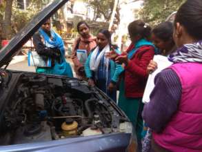 Trainer Geeta leading a car maintainance session