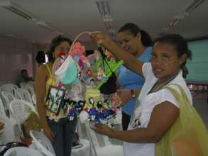 One participant shows off her crafts for sale