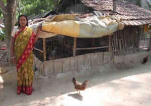 Shila next to her chicken coop