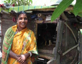 Tinku proudly shows off her chicken coop