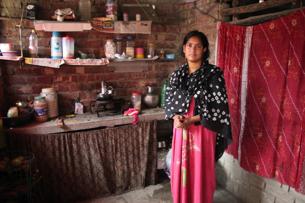 Beneficiary on PDS at home in her kitchen