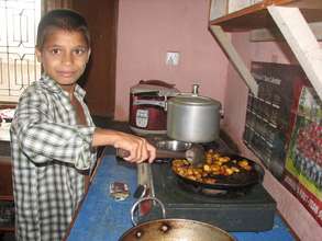 Kamal cooking at the Our Sansar children's home