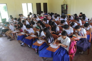 Some of the kids using their books in class