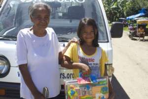 Marivic with her gran Rita and school supplies