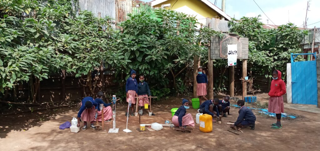 Grade 3 work on projects in the playground