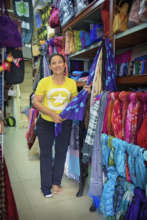 AAC artisan displaying her handicrafts.