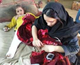 Dr. Zahra Shah of CDRS with a Young Patient