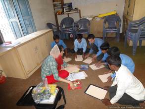 Dr. Rukhsana Chaudhry working with schoolchildren