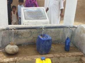 Taps fill residents' containers with clean water