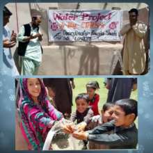 Families and children enjoy their new water pump
