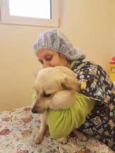 Maple with volunteer Ariane at Center of Hope