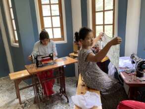 Learning to make their own clothing and small bags