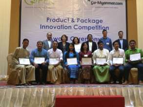 Aye Aung with others at award ceremony in Yangon