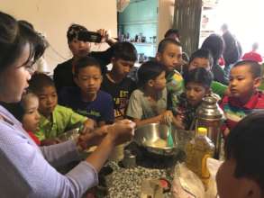 Aye Aung making cakes with Green School students