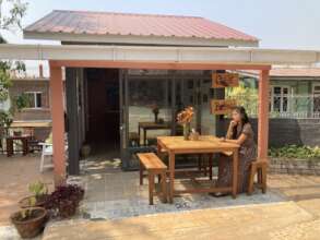 The small shop in front of main cafe building